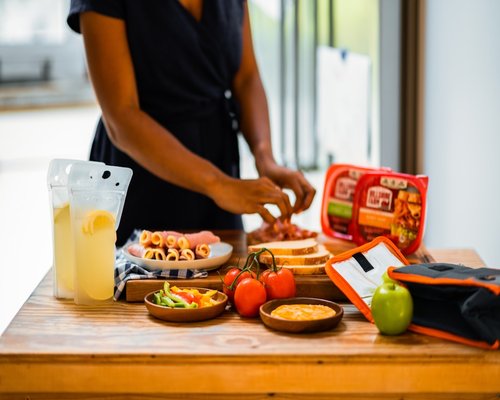 Person preparing a healthy snack with fresh fruit